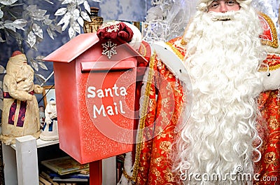 Red mailbox for Christmas letters. Santa mail Stock Photo