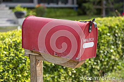 Red mailbox on modern house Stock Photo