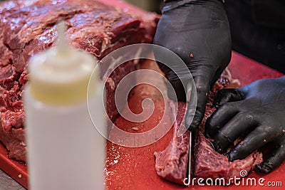 Red meat, chopping, cutting, and filleting premium, fresh, Italian and European Gourmet butchers. Stock Photo