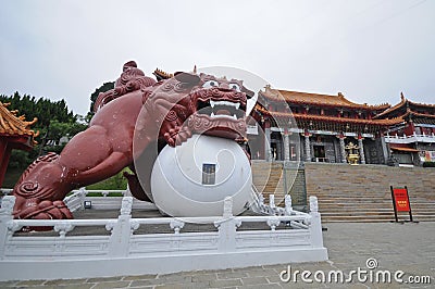 Red metallic guardian lion statur in Sun Moon Lake temple in Taiwan Editorial Stock Photo