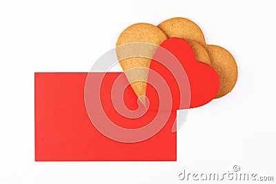 Red mockup greenting card with heart shape cookies on a white backround. Simbol of cozy love and Valentines Day backrgound Stock Photo