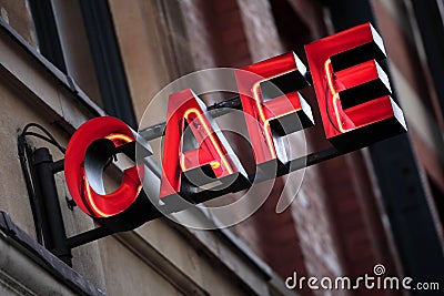 Red neon cafe sign, illuminated at night Stock Photo