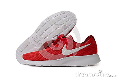 Red Nike brand sneakers. Lightweight reticulate shoes for jogging and walking. Popular modern model for fitness and Editorial Stock Photo