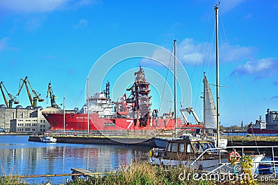 Red offshore and supply ship being repaired in shiprepairing yard Editorial Stock Photo