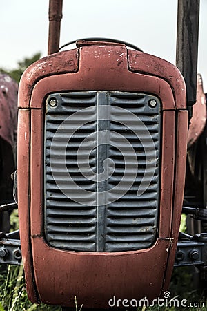 Red old tractor front part Stock Photo