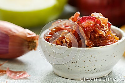 Red onion marmalade jam, confiture, chutney with green Apple Stock Photo