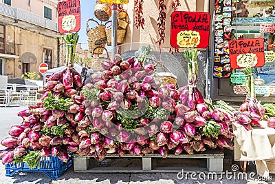 Red onion sold on Tropea`s streets as specialty of the region, Italy Editorial Stock Photo