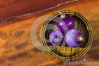 Red onion on wood Stock Photo