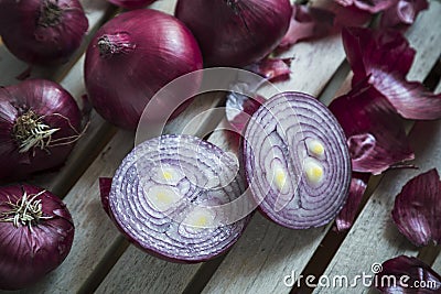 Red Onions on a rustic wooden borad Stock Photo