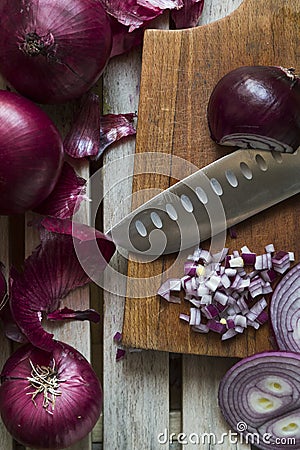 Red Onions on a rustic wooden borad Stock Photo