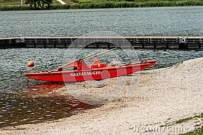 Orange lifeguard rowing boat - Serraia Lake Italy Stock Photo