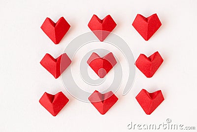 Red origami hearts on white background, above. 14th February Valentine`s day or wedding invite Stock Photo