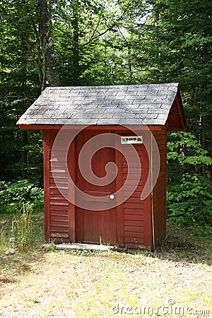 Red Outhouse Stock Photo