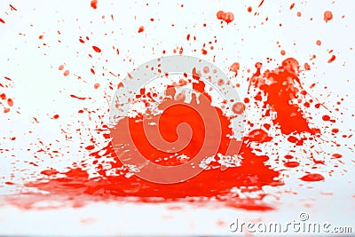 Red paint splat on a white back ground. Stock Photo