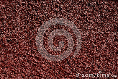 Red painted cement plaster pimpled wall surface Stock Photo