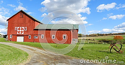 Red barn sits in FingerLakes fall countryside in NYS Stock Photo