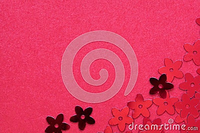 Red palettes in the form of flowers on a red background. Stock Photo
