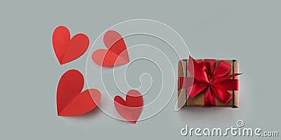 Red paper hearts gray background concept of Valentine& x27;s day Stock Photo