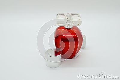 Red parfume bottle on white background with clear cap Stock Photo