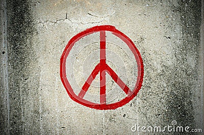 Red peace symbol graffiti on grunge ciment wall Stock Photo