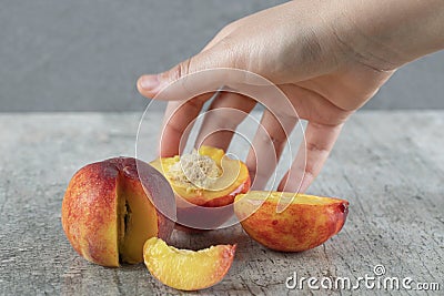 A red peach sliced on the table Stock Photo