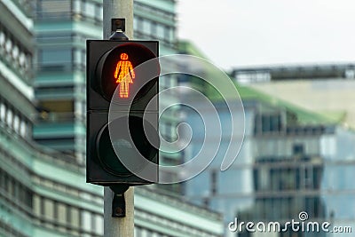 Red pedestrian signal. Traffic light female figure shape in one of avenue in Vilnius, Lithuania Stock Photo