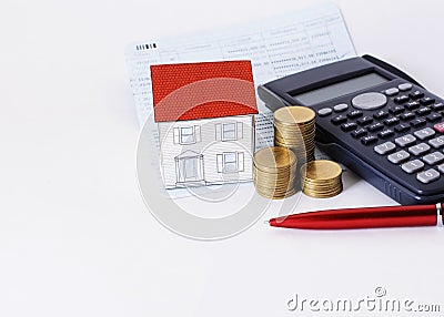 Red pen with coins stack and paper house and calculator on saving book Stock Photo
