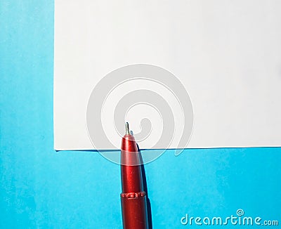 Red pen on a white notebook. diary with red pen Stock Photo