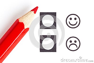 Red pencil choosing the right smiley Stock Photo