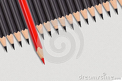 Red pencil among a group of black pencils. the leader takes responsibility and risks Stock Photo