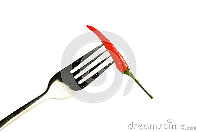 red pepper with drops on a fork isolated on a white background. Stock Photo