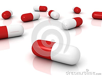 Red pharmaceutical capsules pills on white surface Stock Photo