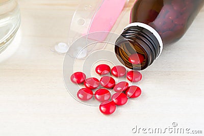 Red pill, patient, with medicine and water Stock Photo