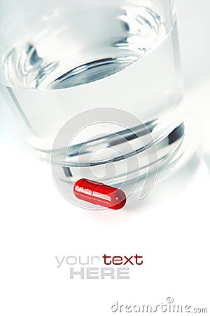 Red pill and water Stock Photo