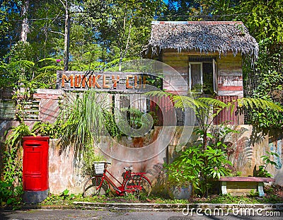Red pillar box and rustic bike Editorial Stock Photo