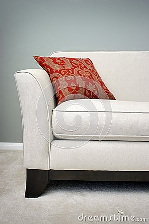 Red Pillow on a Sofa Stock Photo