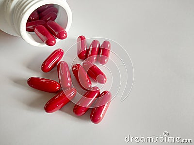 Red Pills Vitamin Red Pills Red on a warm white, clean look Vitamin B Stock Photo