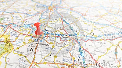 A red pin stuck in Charleroi on a map of Belgium Editorial Stock Photo