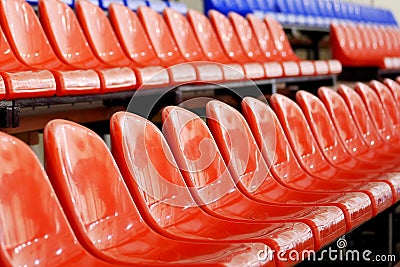 Red spectators seats at stadium Stock Photo