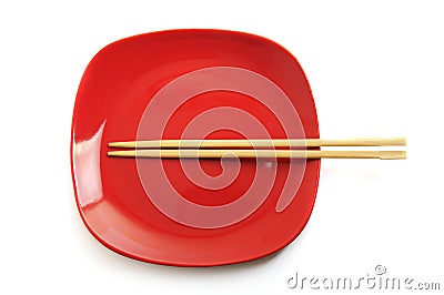 Red plate with chinese sticks Stock Photo