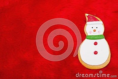 Red Plush Fur and Gingerbread Snowman Christmas Background Stock Photo