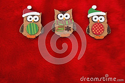 Red Plush Fur and Holiday Owls Christmas Background Stock Photo