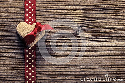 On Red polka dot ribbon, heart-shaped biscuits - wood background Stock Photo