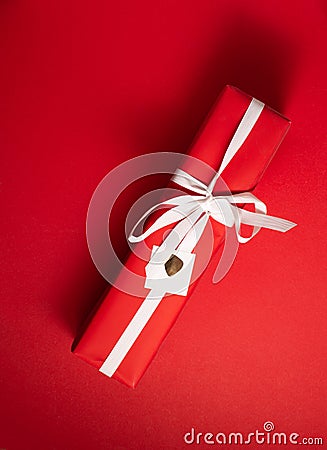 Red present or gift for valentines or christmas on a red background Stock Photo