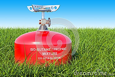 Red primus stove on the green grass against blue sky, 3D rendering Stock Photo