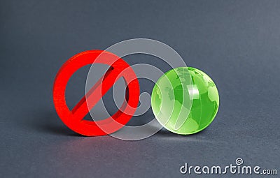 Red prohibition symbol NO and green globe planet earth glass ball. Prohibitions, obstacles and censorship, opponents Stock Photo