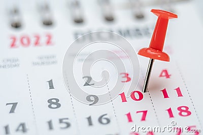 Red push pin on calendar 10th day of the month, mark the Event day with a Pin. Pin on calendar day ten, date number 10 Stock Photo