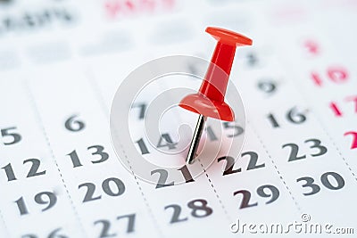 Red push pin on calendar 21th day of the month, mark the Event day with a Pin. Pin on calendar day twenty-one, date Stock Photo