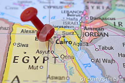 Red Push Pin Pointing Cairo on Location of World Map Close-Up View Stock Photo