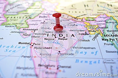 Red Push Pin Pointing India on Location of World Map Close-Up View Stock Photo